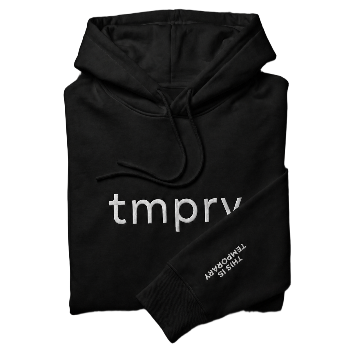 TMPRY Initiation Hood folded neatly in 400GSM raw black fleece, featuring the visible chest logo and "THIS IS TEMPORARY" sleeve branding.